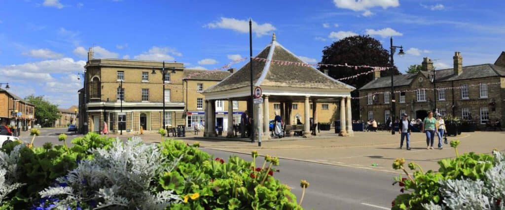 Charming town square in Whittlesey with historic buildings and lively community atmosphere.
