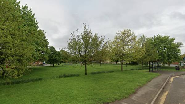 Lush green park with trees and walking paths in Whittlesey, Cambridgeshire, for community recreation and outdoor activities.