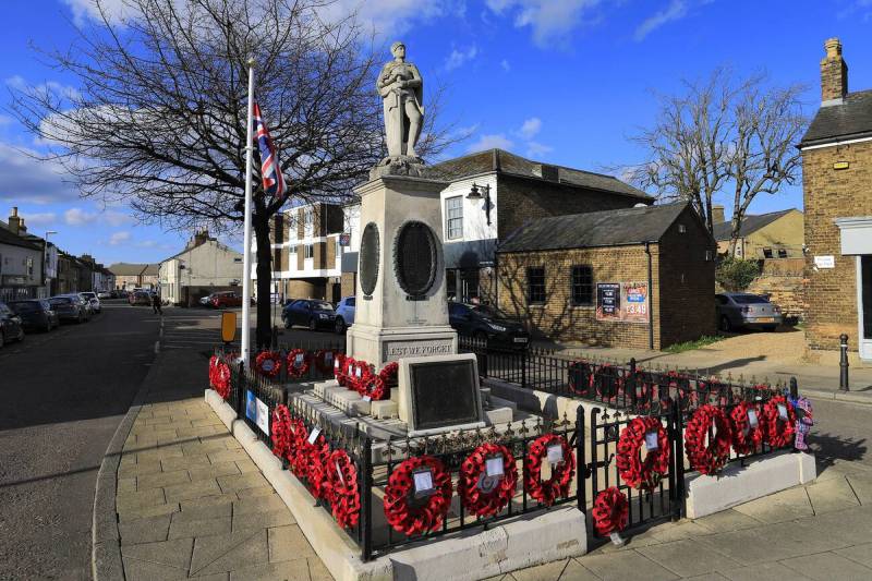 Remembrance memorial with poppy wreaths in Whittlesey commemorating fallen soldiers.