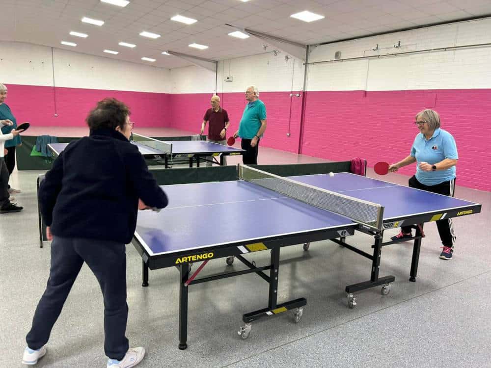 People playing table tennis at The Whittlesey Charity community centre in Cambridgeshire.